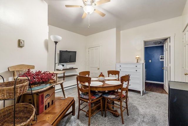 526 N Columbus St, Lancaster, OH 43130 - carpeted dining area with ceiling fan, a baseboard heating unit, and baseboards