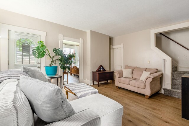 526 N Columbus St, Lancaster, OH 43130 - living area featuring light wood finished floors and stairway