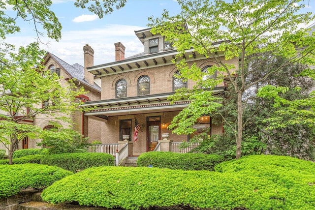 355 W 7th Ave, Columbus, OH 43201 - italianate-style house featuring brick siding and a porch