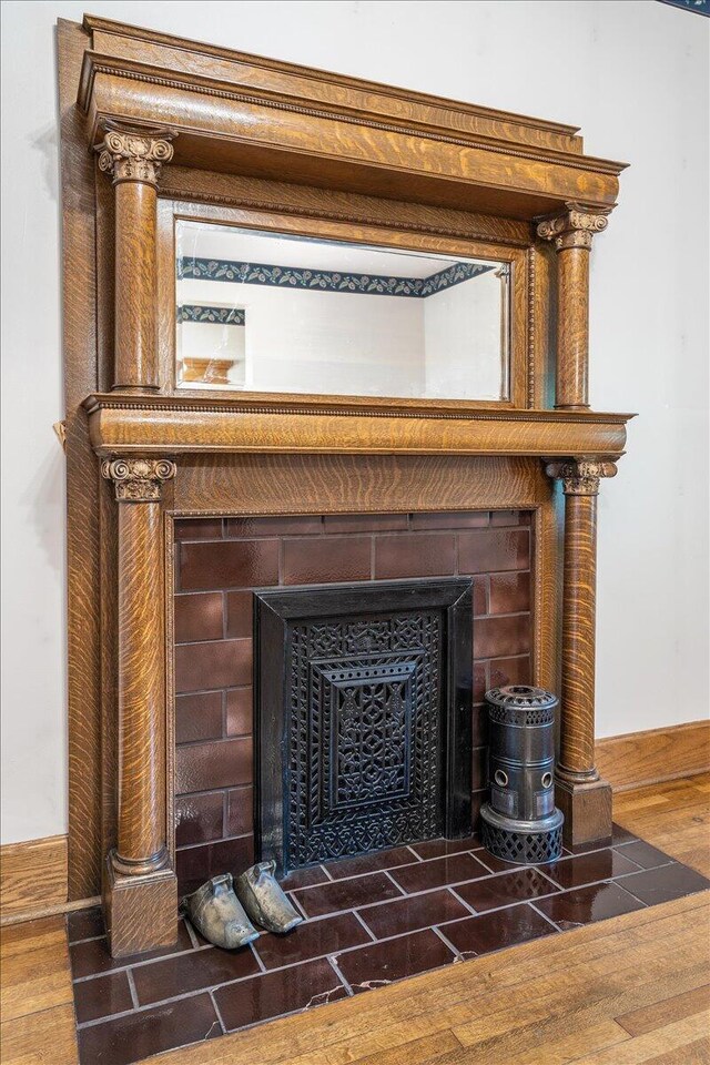 355 W 7th Ave, Columbus, OH 43201 - detailed view of a tiled fireplace and wood finished floors
