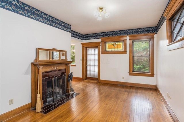 355 W 7th Ave, Columbus, OH 43201 - living room featuring baseboards, hardwood / wood-style flooring, and a fireplace