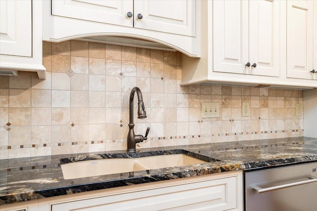 355 W 7th Ave, Columbus, OH 43201 - kitchen with stainless steel dishwasher, a sink, white cabinets, backsplash, and dark stone countertops