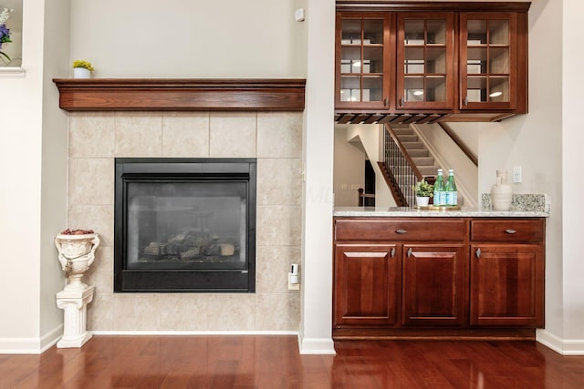 7019 Blakemore Ln, Dublin, OH 43016 - detailed view of wood finished floors, baseboards, and a tile fireplace