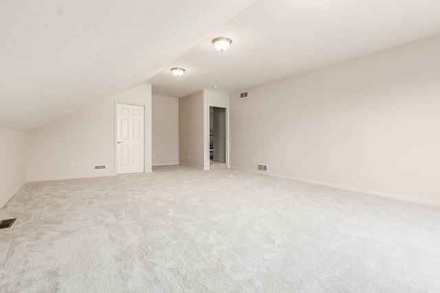 7019 Blakemore Ln, Dublin, OH 43016 - bonus room with vaulted ceiling, light carpet, and baseboards