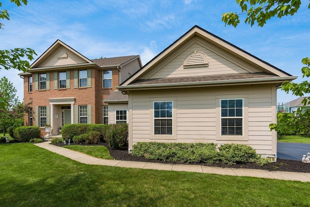7019 Blakemore Ln, Dublin, OH 43016 - view of front of house featuring a front yard and brick siding