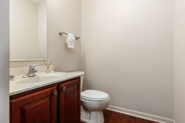 7019 Blakemore Ln, Dublin, OH 43016 - half bathroom featuring toilet, vanity, baseboards, and wood finished floors