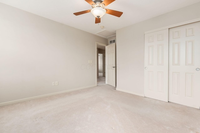 7019 Blakemore Ln, Dublin, OH 43016 - unfurnished bedroom with light colored carpet, a closet, baseboards, attic access, and ceiling fan