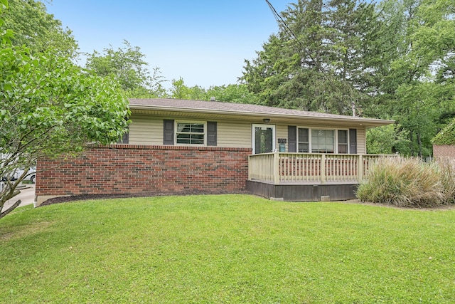 316 Westview Ave, Columbus, OH 43214 - ranch-style house with a front yard, brick siding, and a wooden deck