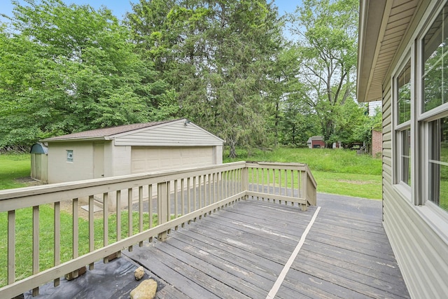316 Westview Ave, Columbus, OH 43214 - deck featuring a detached garage, an outbuilding, and a yard