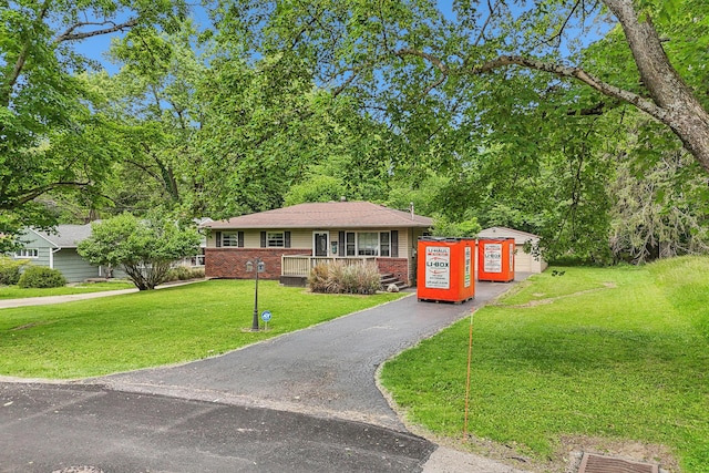 316 Westview Ave, Columbus, OH 43214 - view of front of property with a front lawn, brick siding, and asphalt driveway