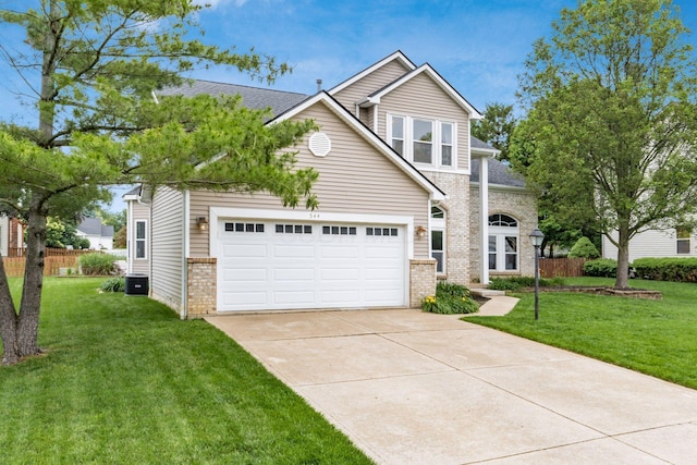 544 Courtright Ct, Pickerington, OH 43147 - traditional-style house featuring brick siding, driveway, a garage, and central air condition unit
