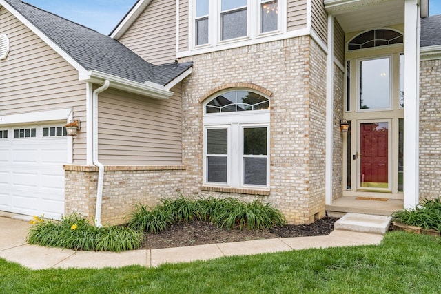 544 Courtright Ct, Pickerington, OH 43147 - property entrance featuring brick siding, roof with shingles, and a garage