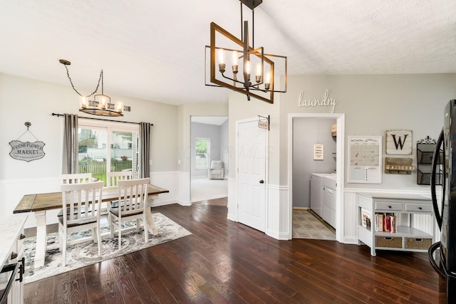 544 Courtright Ct, Pickerington, OH 43147 - dining room featuring a chandelier, washing machine and clothes dryer, and dark wood finished floors