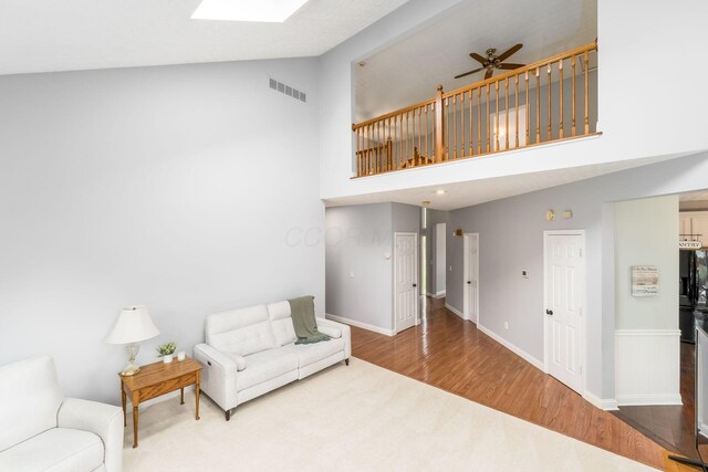 544 Courtright Ct, Pickerington, OH 43147 - living area with ceiling fan, high vaulted ceiling, wood finished floors, baseboards, and carpet
