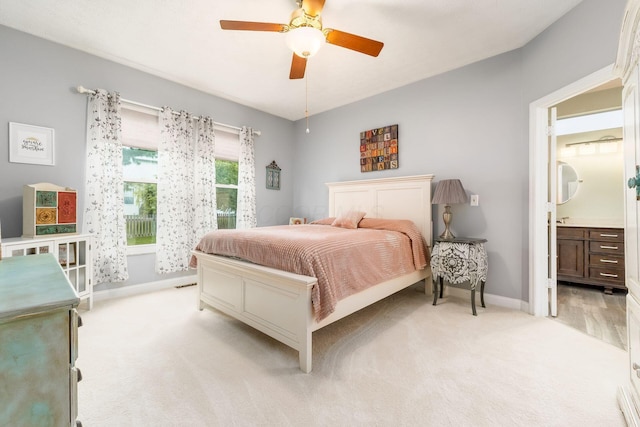 544 Courtright Ct, Pickerington, OH 43147 - bedroom with light colored carpet, baseboards, a ceiling fan, and ensuite bathroom