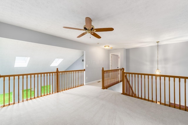 544 Courtright Ct, Pickerington, OH 43147 - carpeted empty room featuring ceiling fan, a skylight, baseboards, and a textured ceiling