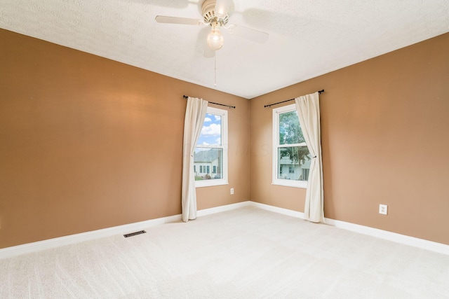 544 Courtright Ct, Pickerington, OH 43147 - unfurnished room featuring light colored carpet, ceiling fan, baseboards, and a textured ceiling