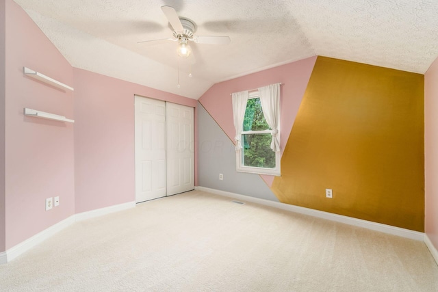 544 Courtright Ct, Pickerington, OH 43147 - unfurnished bedroom featuring lofted ceiling, carpet floors, a textured ceiling, baseboards, and a closet
