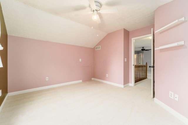 544 Courtright Ct, Pickerington, OH 43147 - additional living space with ceiling fan, light colored carpet, lofted ceiling, and baseboards