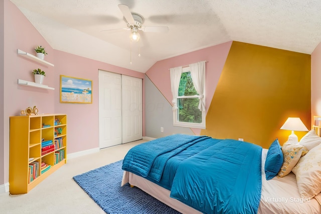 544 Courtright Ct, Pickerington, OH 43147 - carpeted bedroom featuring vaulted ceiling, baseboards, a textured ceiling, a closet, and ceiling fan