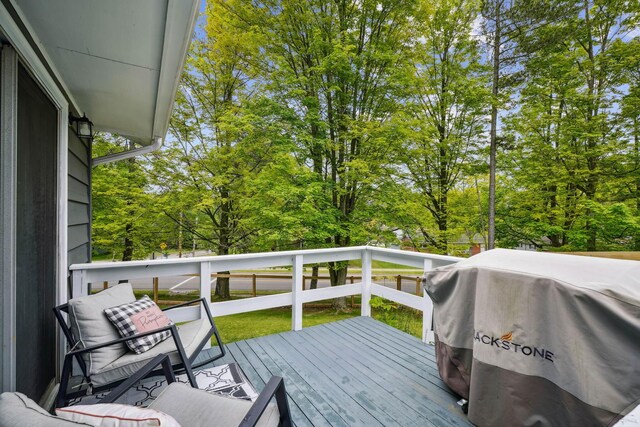 710 Cloverleaf Ct, Mansfield, OH 44904 - wooden terrace with area for grilling and view of wooded area