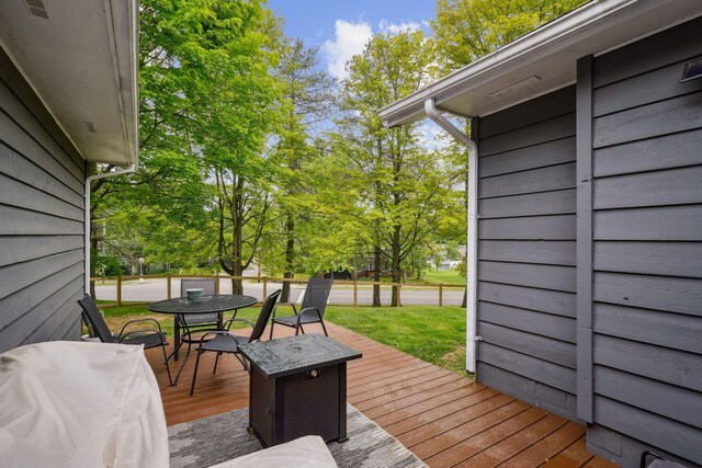 710 Cloverleaf Ct, Mansfield, OH 44904 - deck with outdoor dining area and view of scattered trees