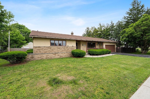 300 Stockbridge Rd, Columbus, OH 43207 - ranch-style home featuring driveway, brick siding, an attached garage, and a chimney