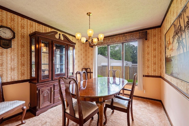 300 Stockbridge Rd, Columbus, OH 43207 - dining space featuring wallpapered walls, a textured ceiling, a chandelier, light carpet, and baseboards