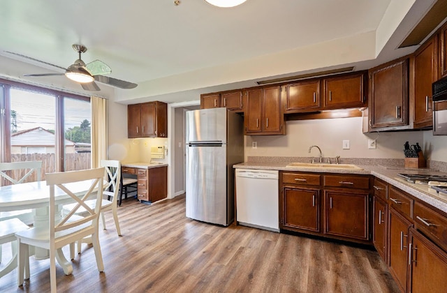 300 Stockbridge Rd, Columbus, OH 43207 - kitchen featuring dishwasher, a sink, freestanding refrigerator, wood finished floors, and a ceiling fan