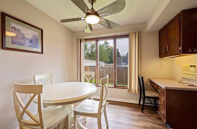 300 Stockbridge Rd, Columbus, OH 43207 - dining area with wood finished floors, ceiling fan, and baseboards