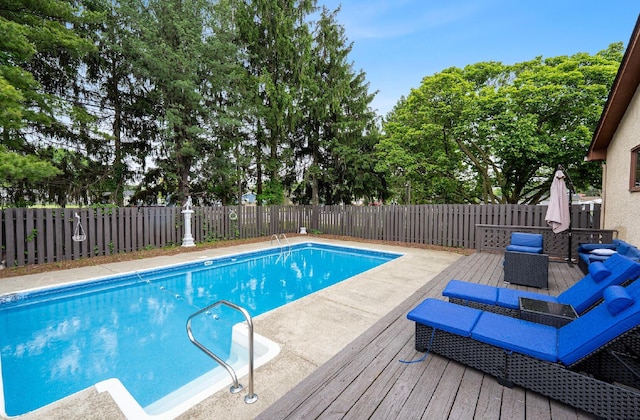 300 Stockbridge Rd, Columbus, OH 43207 - view of pool featuring a fenced backyard, a wooden deck, and view of scattered trees