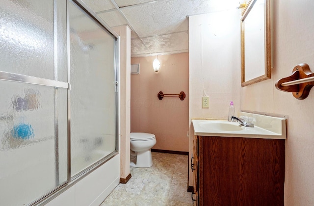 300 Stockbridge Rd, Columbus, OH 43207 - full bathroom with toilet, vanity, combined bath / shower with glass door, and baseboards