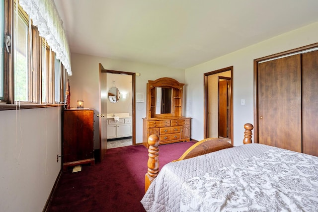 300 Stockbridge Rd, Columbus, OH 43207 - carpeted bedroom featuring ensuite bath, a closet, and baseboards
