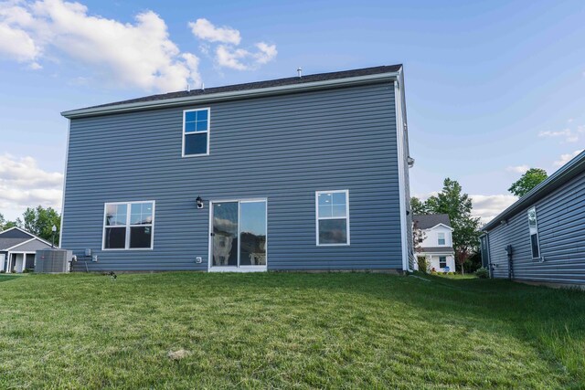 5914 Damsel Dr, Columbus, OH 43232 - rear view of house featuring central AC and a yard