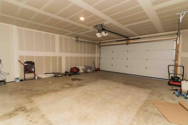 5914 Damsel Dr, Columbus, OH 43232 - garage featuring a garage door opener