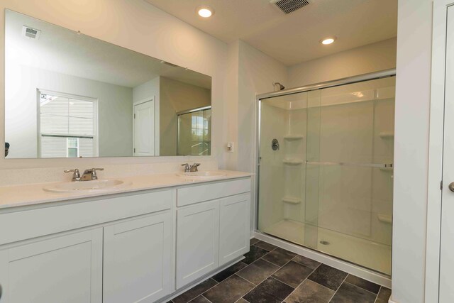 5914 Damsel Dr, Columbus, OH 43232 - full bath with a stall shower, double vanity, and recessed lighting
