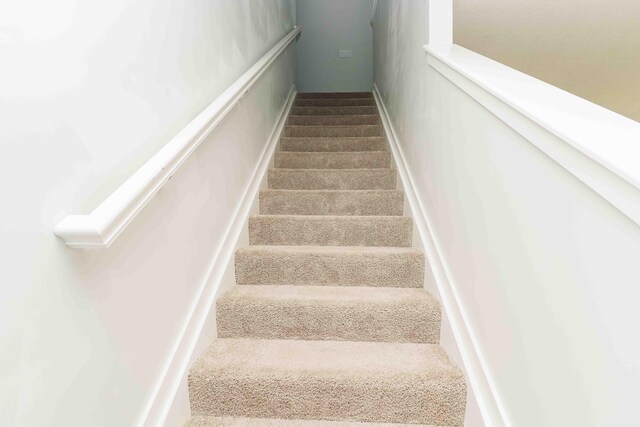 5914 Damsel Dr, Columbus, OH 43232 - stairway featuring carpet floors
