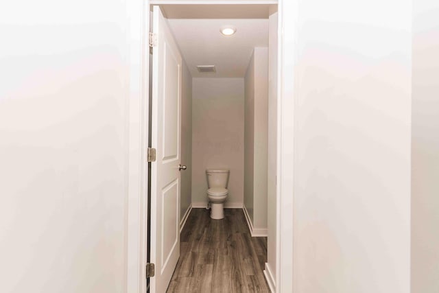5914 Damsel Dr, Columbus, OH 43232 - hall featuring dark wood finished floors and baseboards