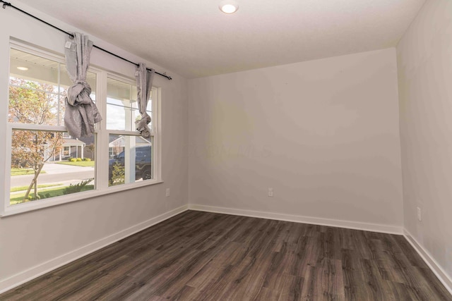 5914 Damsel Dr, Columbus, OH 43232 - empty room featuring dark wood-style floors, baseboards, and recessed lighting