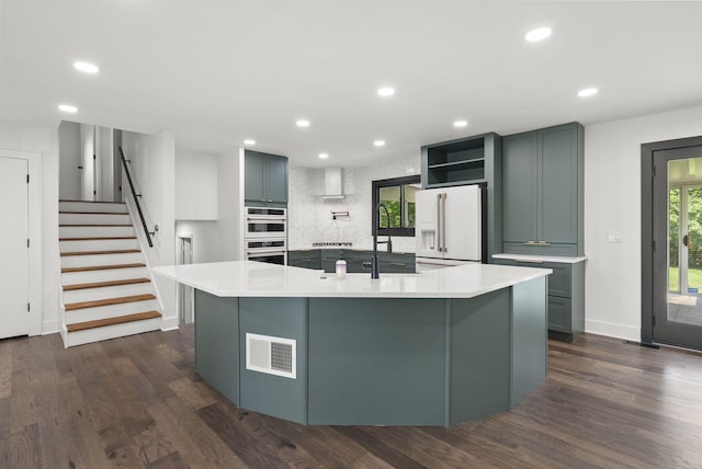 4200 Rudy Rd, Columbus, OH 43214 - kitchen with white appliances, recessed lighting, a spacious island, dark wood-type flooring, and light countertops