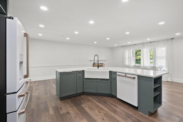4200 Rudy Rd, Columbus, OH 43214 - kitchen with white appliances, light countertops, recessed lighting, dark wood-style flooring, and an island with sink