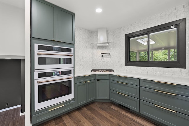 4200 Rudy Rd, Columbus, OH 43214 - kitchen featuring double oven, tasteful backsplash, light countertops, and dark wood-type flooring