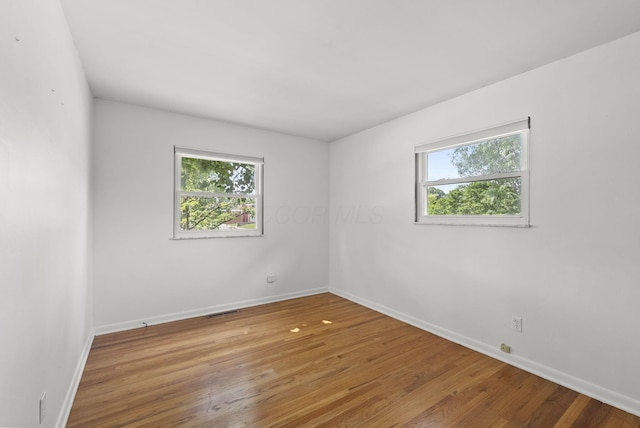 4200 Rudy Rd, Columbus, OH 43214 - unfurnished room with healthy amount of natural light and wood finished floors