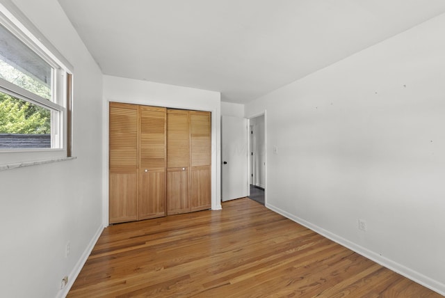 4200 Rudy Rd, Columbus, OH 43214 - unfurnished bedroom with wood finished floors and a closet