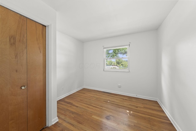 4200 Rudy Rd, Columbus, OH 43214 - unfurnished bedroom with wood finished floors and a closet