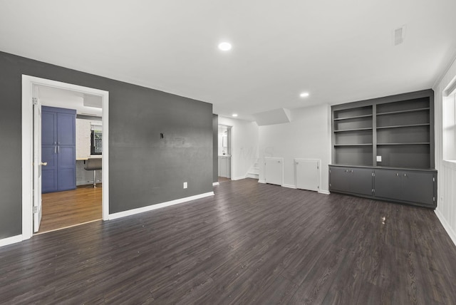 4200 Rudy Rd, Columbus, OH 43214 - unfurnished living room with dark wood-type flooring, stairway, built in shelves, and recessed lighting