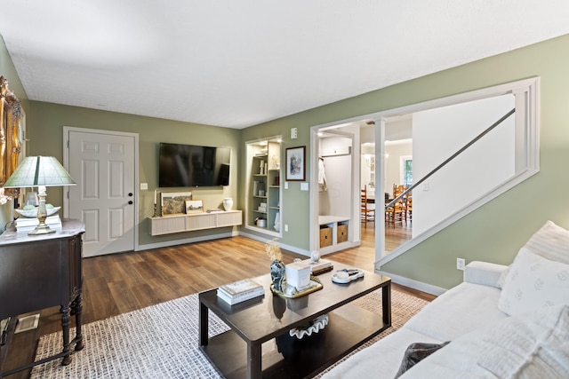 2194 Worthingwoods Blvd, Powell, OH 43065 - living room featuring wood finished floors, stairs, built in features, and baseboards