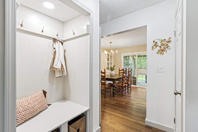 2194 Worthingwoods Blvd, Powell, OH 43065 - mudroom featuring dark wood-style floors and a chandelier