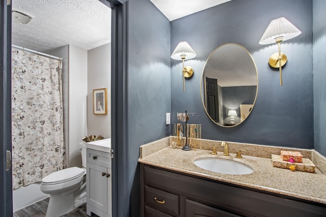 2194 Worthingwoods Blvd, Powell, OH 43065 - bathroom with vanity, a textured ceiling, toilet, and wood finished floors