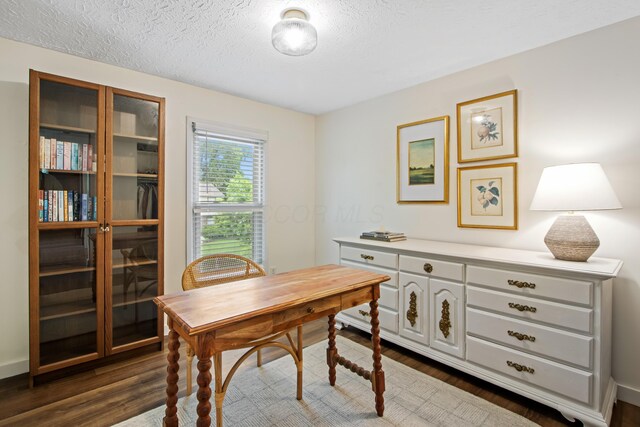 2194 Worthingwoods Blvd, Powell, OH 43065 - home office with dark wood finished floors and a textured ceiling